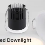 Compact LED recessed downlight with black housing and white trim